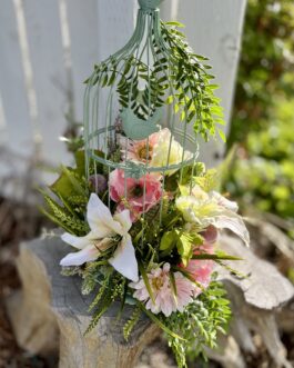 Green bird cage flower arrangement