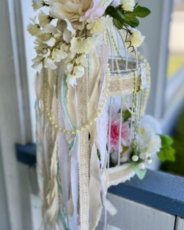 Shabby Chic romantic bird cage with flowers and candles